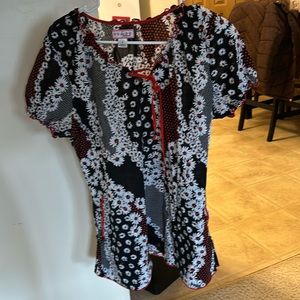 Koi scrub top red, black, and white. Size large.